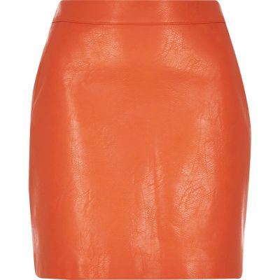 Coral leather-look mini skirt